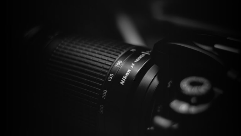 Best Nikon Camera Lenses - Header - StudioBinder